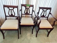 Front view of all three chairs showing style, upholstery and arms