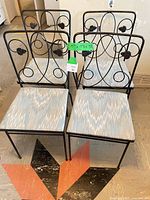 Front view of all four chairs showing design, upholstery, and lot size