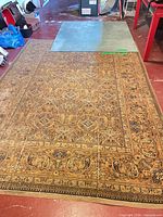 Large oriental style rug covering floor