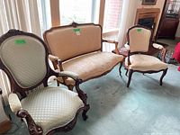 Front view of sofa and both armchairs showing overall style and upholstery condition