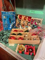 Overall lot with boxed ornaments, lights and pinecones