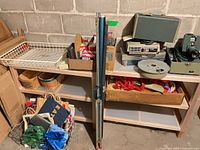 overall view showing shelving, both projectors, carousel, scouring pads, bags