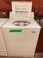 Full front view of Whirlpool washer with lid open