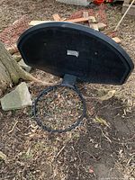 Front of black Lifetime backboard with rim attached