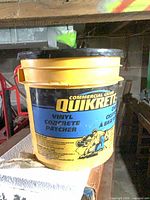 Labeled yellow bucket on shelf