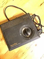 Top view showing Channel Master automatic antenna control unit with rotary compass dial and attached power cord