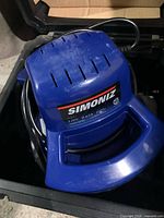 Top view of Simoniz polisher showing brand label and blue housing