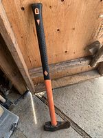 Full view of splitting axe showing handle and head