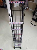 Full view from top showing eight tiered wire baskets and Union Jack shelf fronts