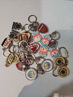 Mixed pile of club keyrings showing variety and quantity