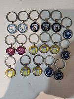 All 20 keychains arranged in grid showing club variety