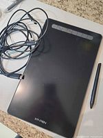 Front view of XP-Pen Artist 12 tablet with cable and stylus