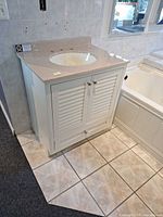 Front view of vanity showing cabinet and integrated sink