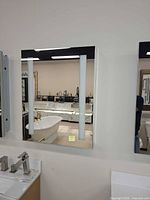 Front view of Afina Illume LED medicine cabinet showing mirror door and LED light strips