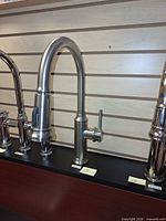 Full view of Blanco gooseneck faucet mounted on display board