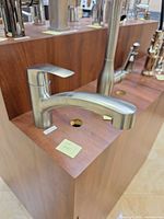 Grohe Eurosmart brushed stainless pull-out faucet mounted on display board