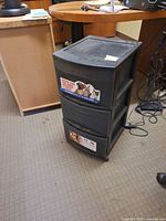 Front view of Sterilite 3-drawer unit showing stickers and casters