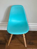 Front view of turquoise kids chair