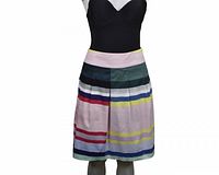 Front view of pleated striped skirt on mannequin