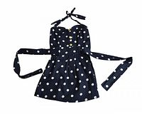 Front view of navy polka dot halter mini dress with waist ties extended