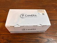 Closed box labeled IP Camera Panoramic HD outdoor camera