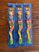 Front view of three sealed Bob the Builder Zooth toothbrushes