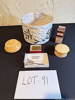 Overall lot showing basket, spoon box, two trinket boxes, flower frog pins, vintage box