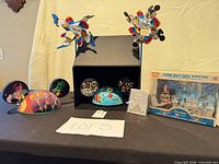 Group shot showing Funko Pop set, two ear hats with tags, two pinwheels