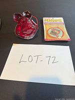 Lot overview showing both items: red novelty light and packaged air freshener