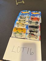 Stack of ten Hot Wheels blister packs showing quantity and variety