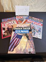 All magazines fanned out on table showing titles