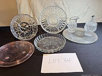 All seven glass items arranged together for complete lot overview