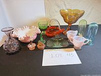 Group view of all glass items in lot