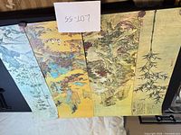 Four of the five vertical Chinese style prints laid side by side