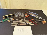 Group shot of entire lot displaying glasses, openers, stoppers, swizzles, boxed items