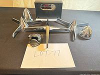 Group view of inflator, hubcap spinners, bullet caps, bottle opener