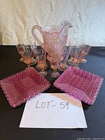 Full set showing pitcher, nine glasses and four plates