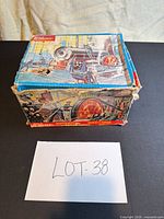 Closed original Wilesco box showing wear and graphics