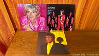 Front covers of all three Rod Stewart albums displayed on table