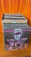 Front view showing April Wine LP in front of box filled with additional records