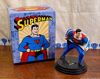 Statue with original box front view