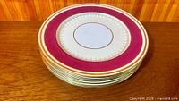 Stack of ten Paragon Canterbury dinner plates, side angle shows pattern and stacking count