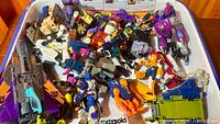 Top view of entire tray of mixed Transformers parts and figures