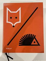 Front cover showing orange cloth with fox and hedgehog graphics