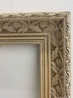 Close-up of holly leaf carving on corner