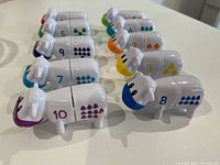 Ten assembled cows showing numerals 1-10 and matching dots