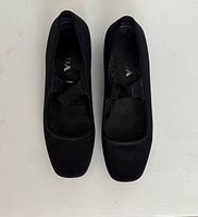 Top view of both Prada neoprene flats showing uppers and straps