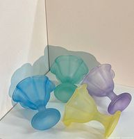 Four pastel frosted glass bowls side view to show colors and pedestal design