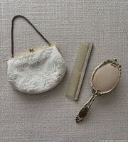 Purse, comb and hairbrush full view