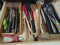 Drawer view showing knives, utensils and shears